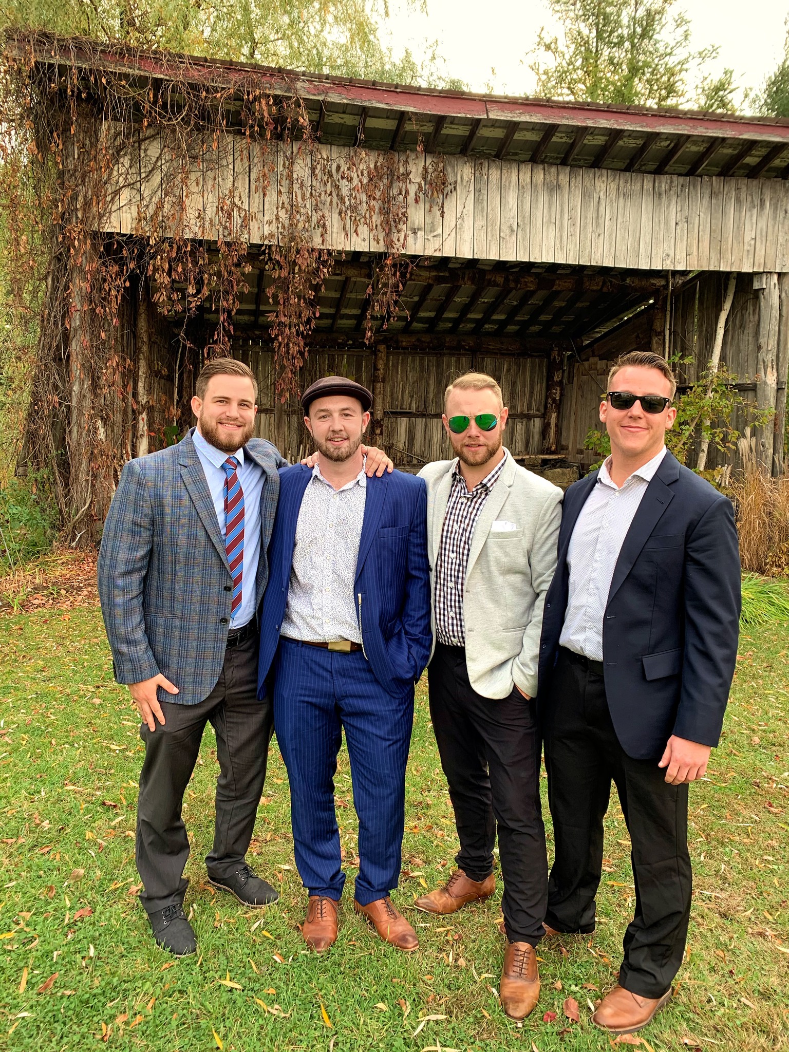 Lucky Union bartending team dressed up at a rustic outdoor event venue